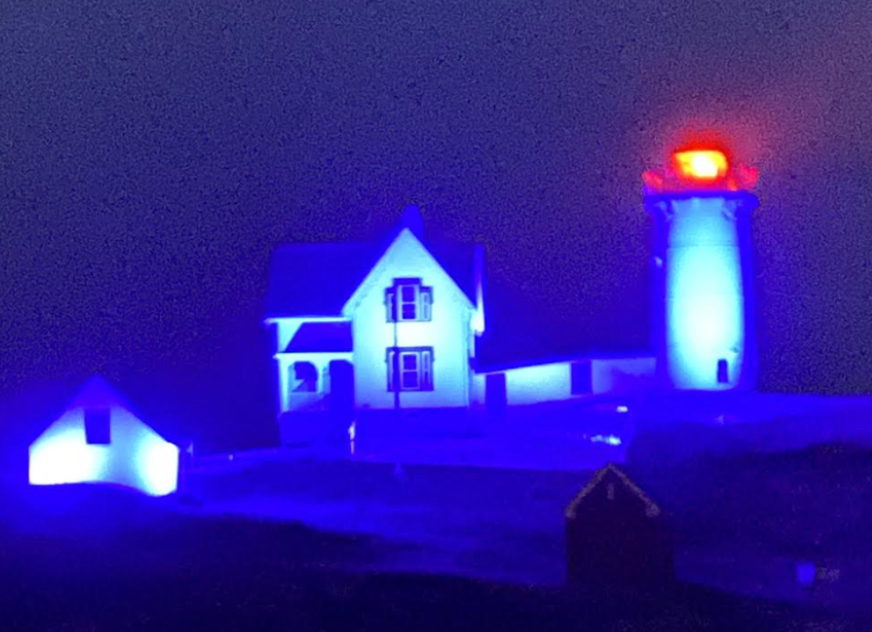 The Nubble Lighthouse aglow in blue